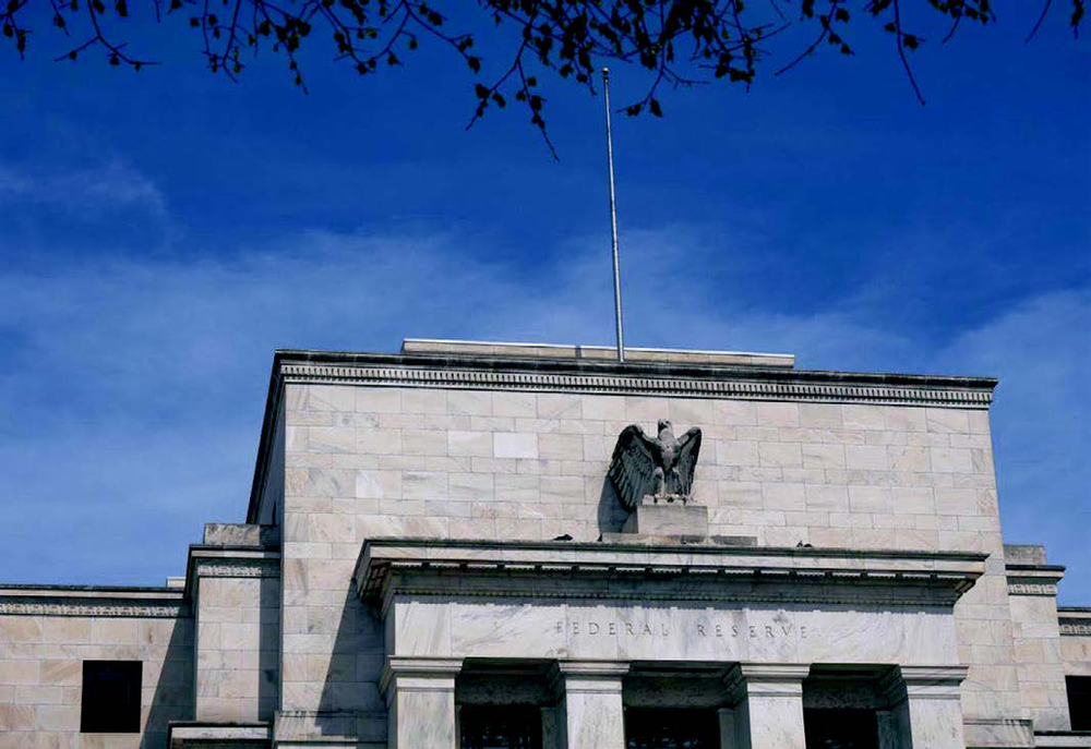 The Fed implements a significant rate reduction and anticipates additional cuts ahead.